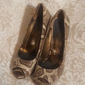 Nine West snake skin peep toe pumps.